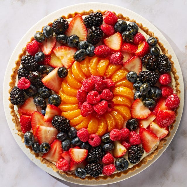 tart topped with blueberries, raspberries, sliced strawberries, blackberries, and orange slices