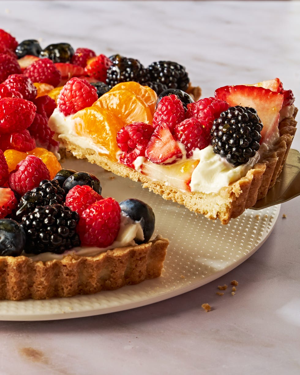 tart topped with blueberries, raspberries, sliced strawberries, blackberries, and orange slices