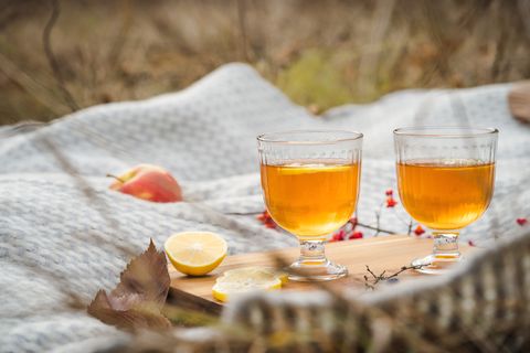 fruit tea with lemon slices on a blanket for thanksgiving ideas