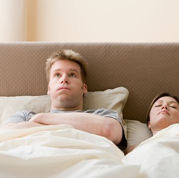 frustrated man and sleeping woman