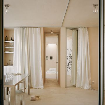 a bathroom with a white curtain