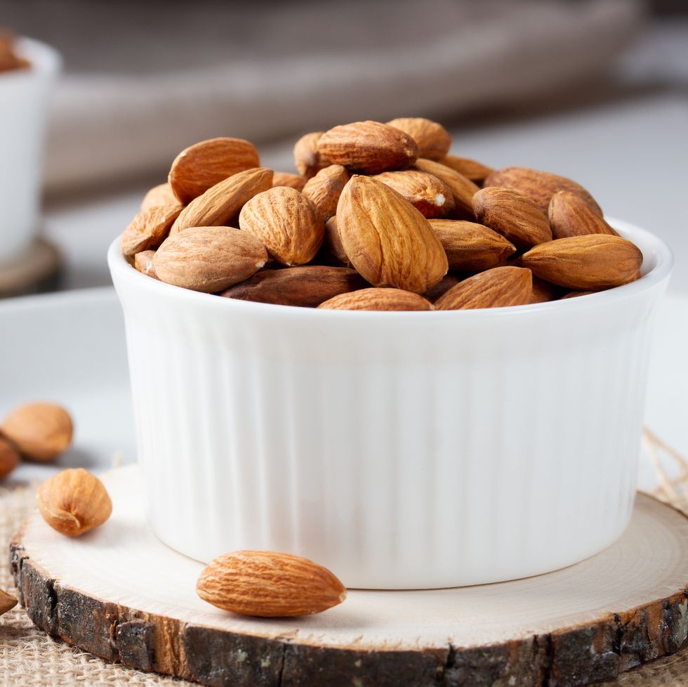 full bowl of almond nuts, rustic style