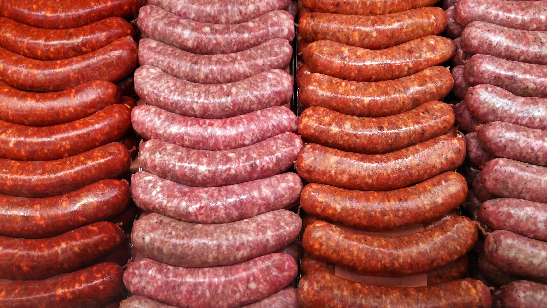 https://hips.hearstapps.com/hmg-prod/images/full-frame-shot-of-sausages-royalty-free-image-1634214135.jpg