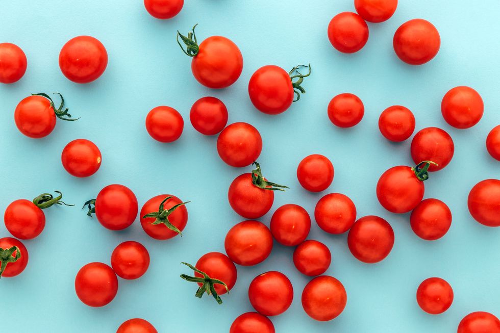 full frame shot of tomatoes against blue background