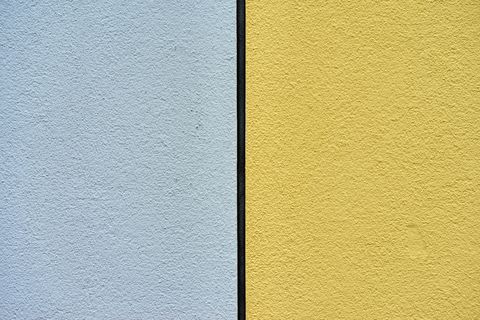 full frame shot of yellow and gray concrete wall