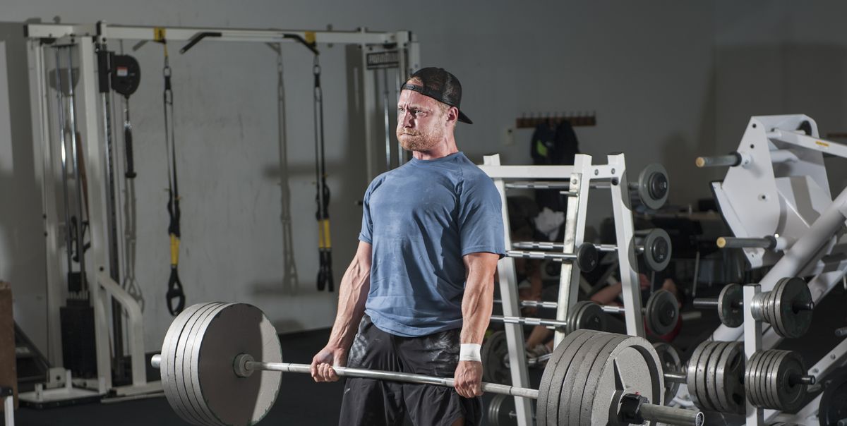 https://hips.hearstapps.com/hmg-prod/images/full-length-of-young-man-lifting-barbell-in-gym-royalty-free-image-1755702200.pjpeg?crop=1.00xw:0.631xh;0,0.133xh&resize=1200:*