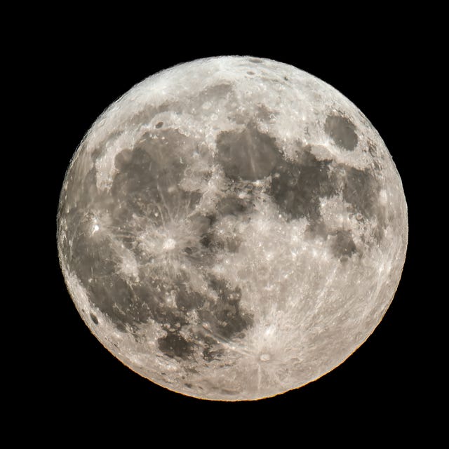 full moon over a dark sky