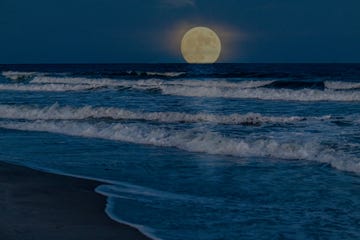 full super moon rising over ocean near myrtle beach south carolina