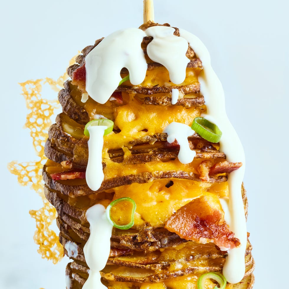 fully loaded tornado potato with sour cream scallions cheddar cheese and gochugaru