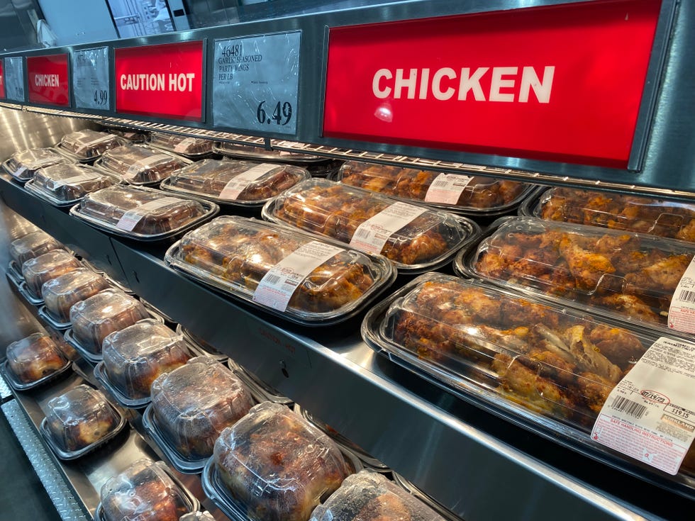 fully stocked rotisserie chicken display at costco, queens, new york
