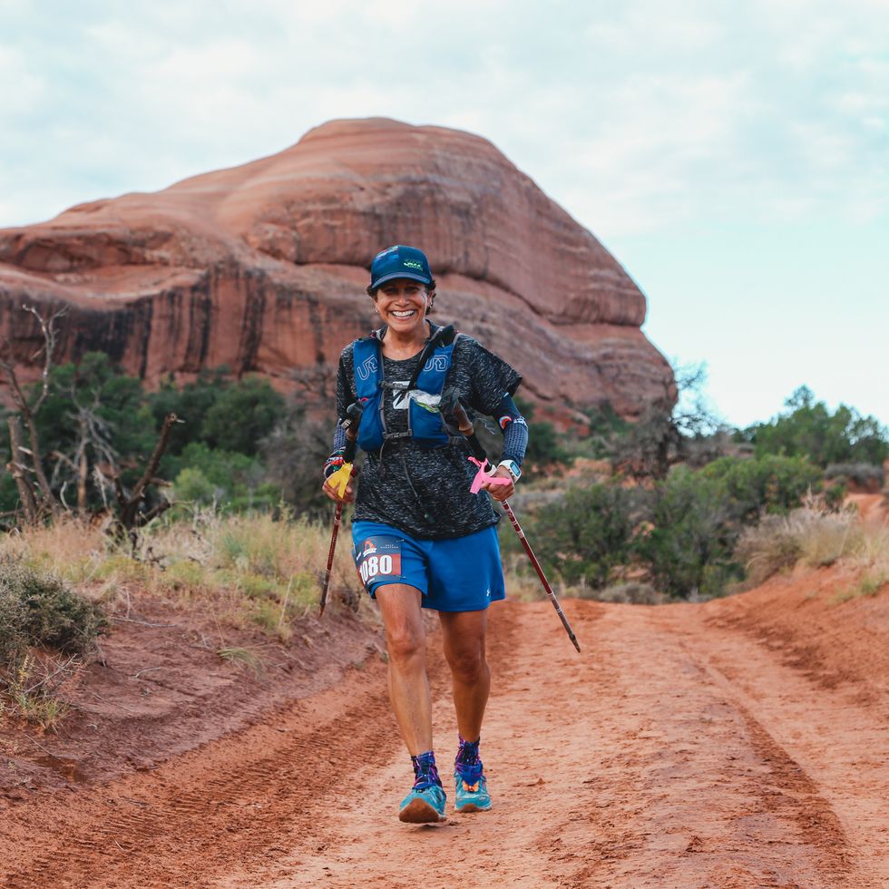 a runner crests a hill in the arches half marathon