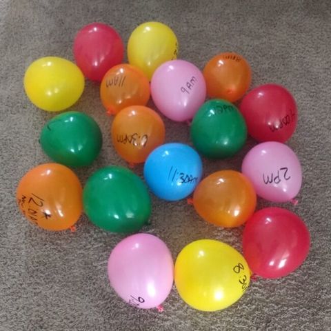 ballons on the ground as part of a balloon pop schedule