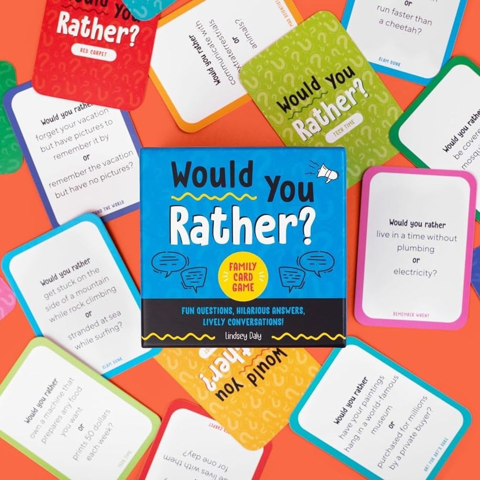 would you rather cards scattered around on a red background