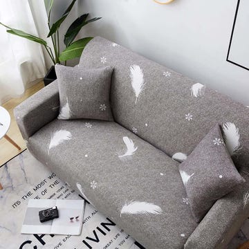 funda para sofá gris con plumas