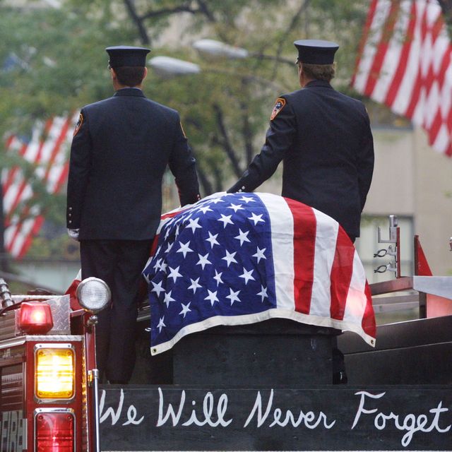394771 03 firefighters stand atop a fire engine with the flag draped casket of fellow fireman lt dennis mojica september 21, 2001 during a funeral service at st patrick's cathedral in new york city mojica, who was with rescue company 1, is one of nearly 300 firefighters who lost their lives in the world trade center disaster photo by joe raedlegettyimages