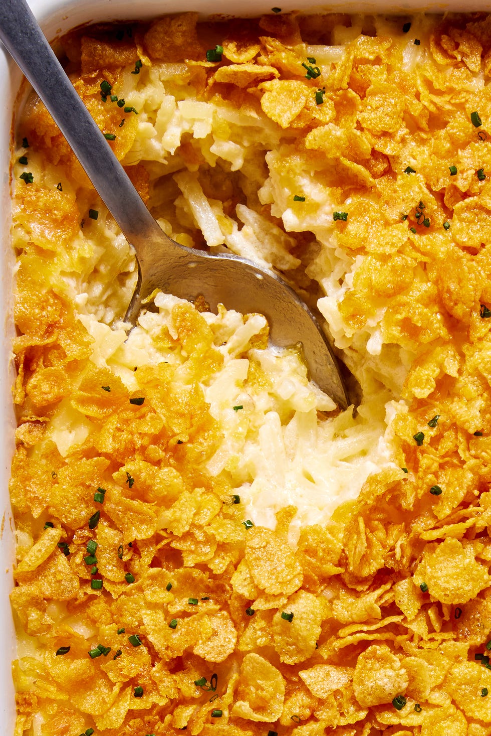 creamy cheesy potatoes with a buttery cornflake topping