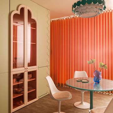 dining room with colourful display cabinet