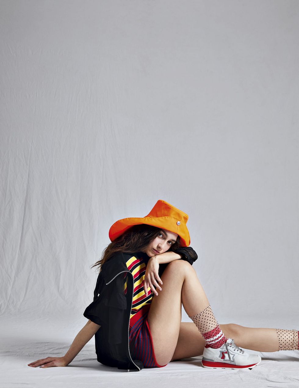 Red, Shoulder, Yellow, Joint, Human leg, Leg, Photo shoot, Photography, Headgear, Hat, 