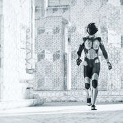 futuristic city street with walking cyborg