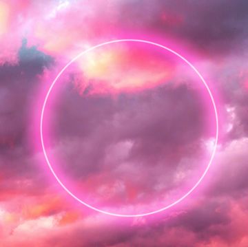 futuristic neon circle in the burning sky with stunning pink colors