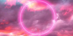 futuristic neon circle in the burning sky with stunning pink colors