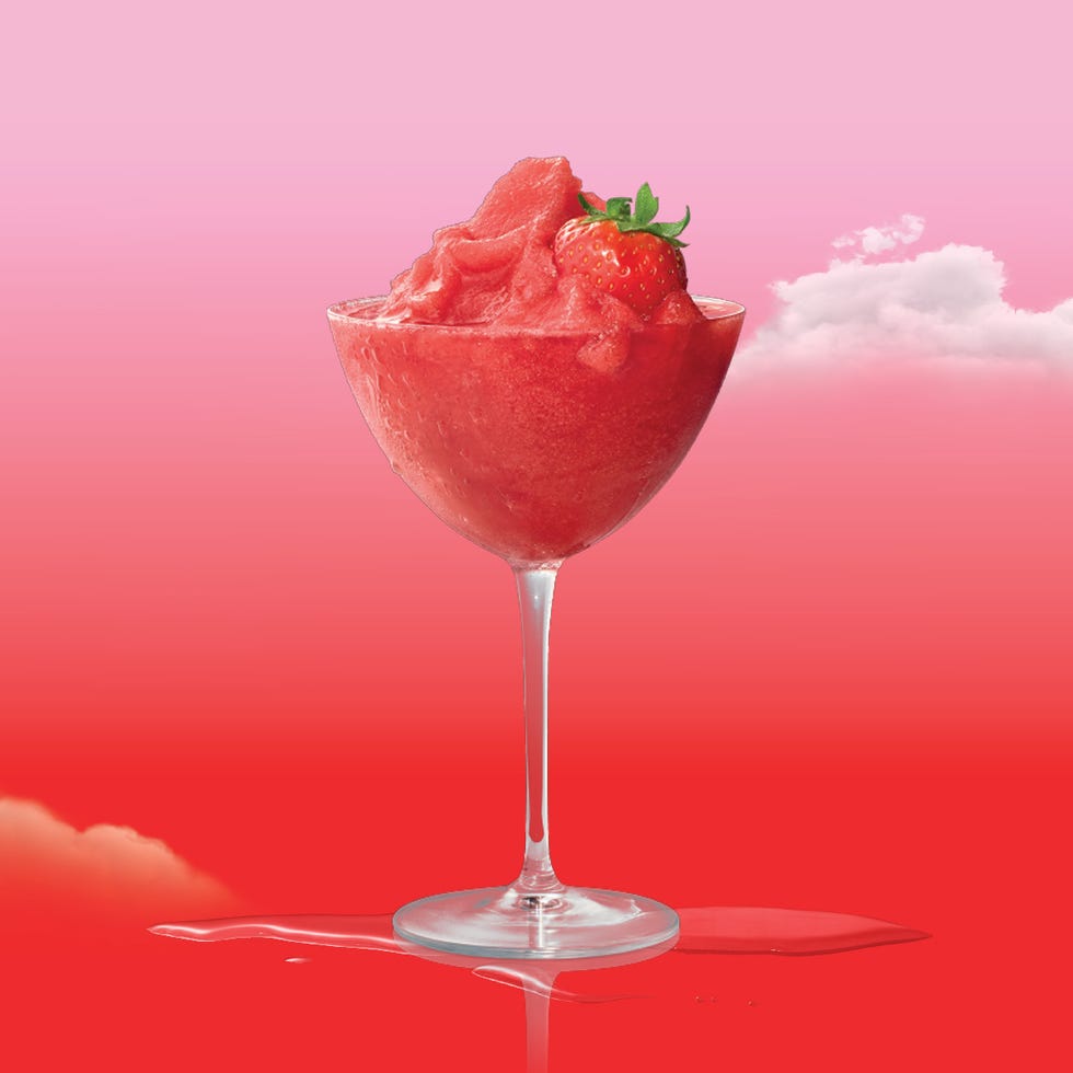 pink cocktails frozen strawberry daiquiri in a coupe garnished with a whole strawberry