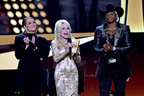 las vegas, nevada   march 07 l r co hosts gabby barrett, dolly parton, and jimmie allen speak onstage during the 57th academy of country music awards at allegiant stadium on march 07, 2022 in las vegas, nevada photo by kevin wintergetty images for acm