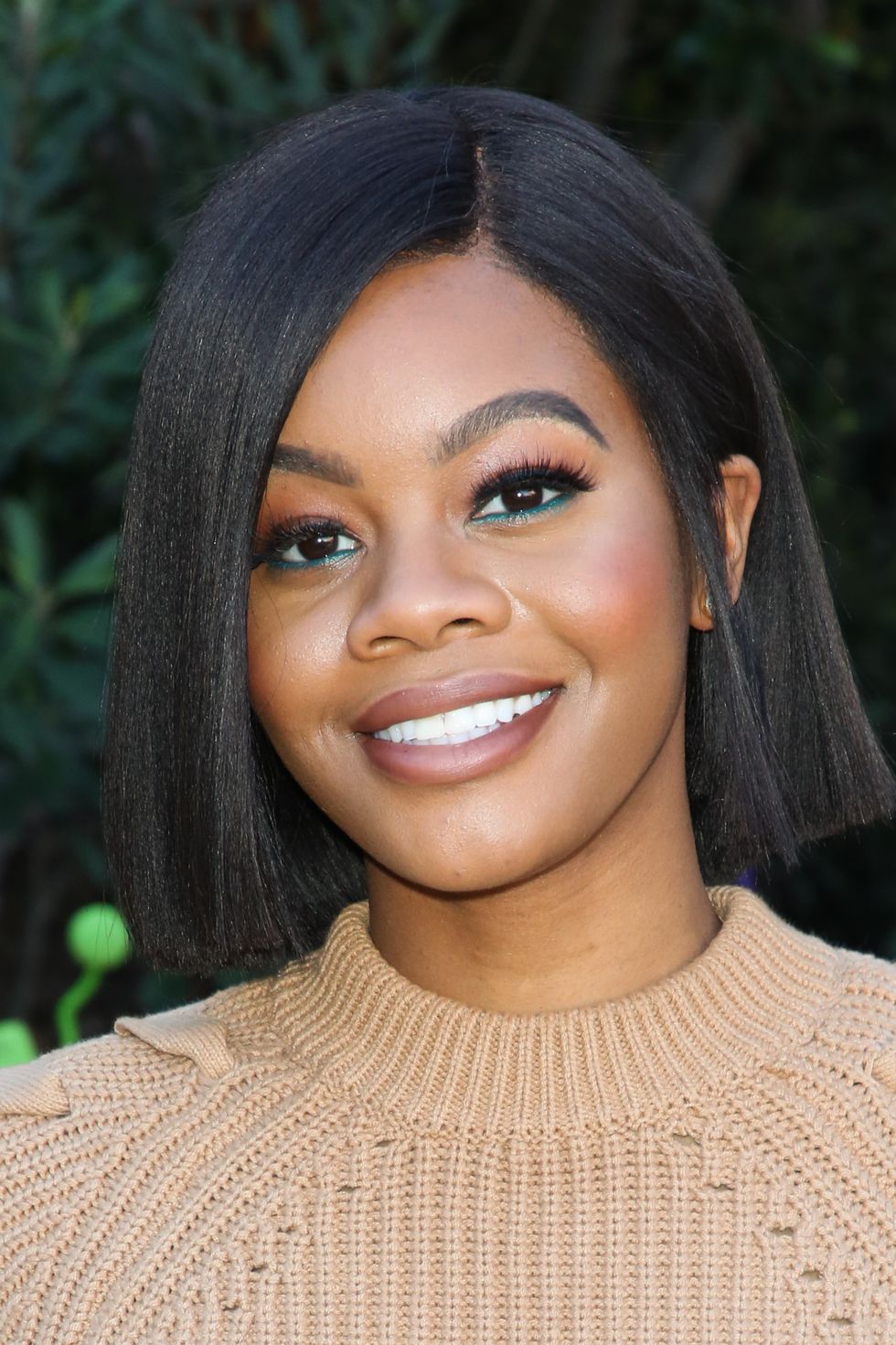 https://hips.hearstapps.com/hmg-prod/images/gabby-douglas-beautiful-hairstyles-for-every-age-1556118511.jpg?crop=0.657xw:0.789xh;0.179xw,0.0153xh&resize=980:*