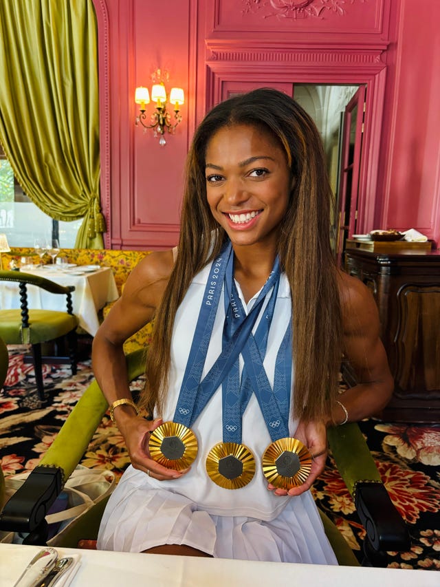 gabby thomas with three medals