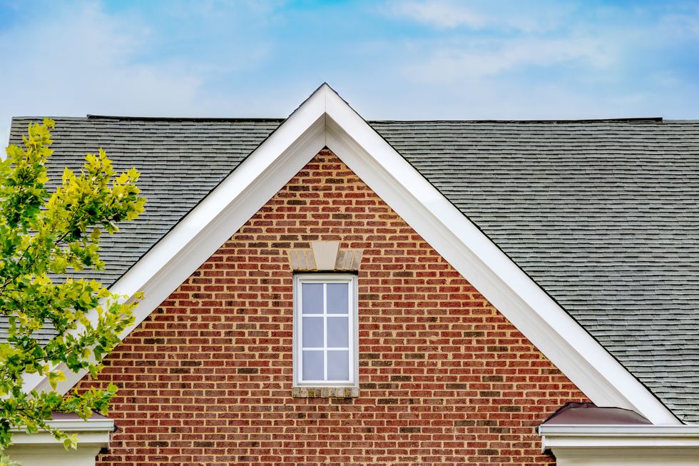 gable roof on brick townhouse