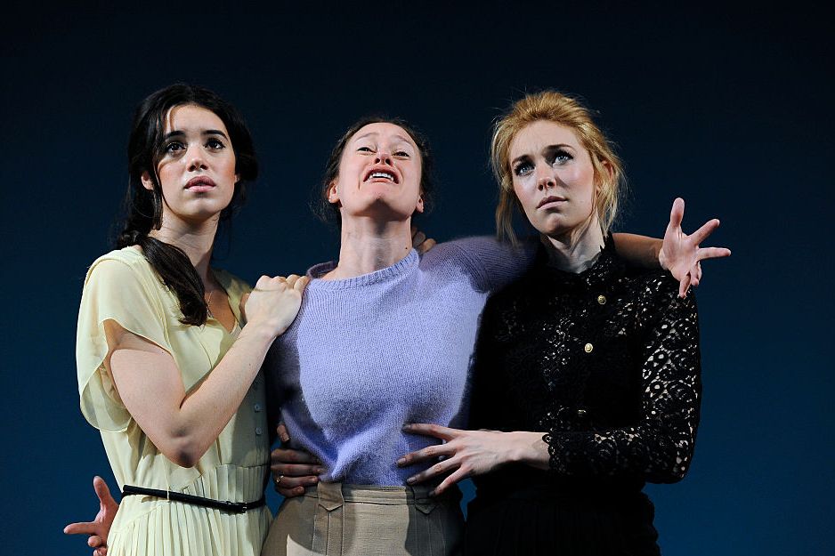 gala gordon, mariah gale, and vanessa kirby hold each other and performing a scene on a stage