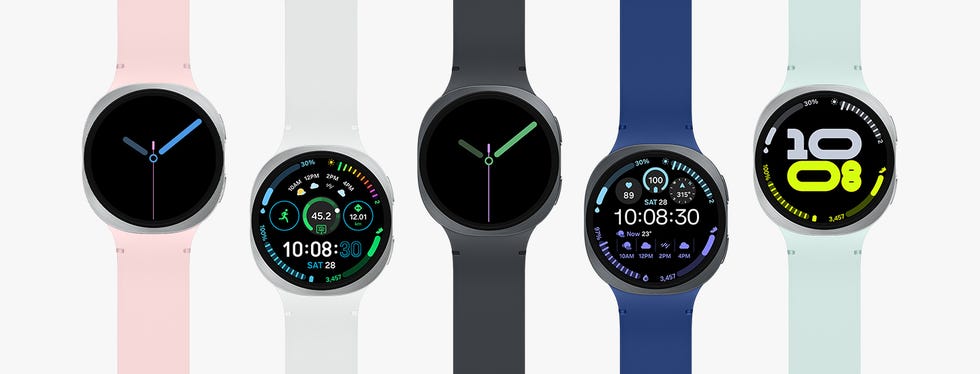 smartwatches displayed in a row with various designs and watch faces