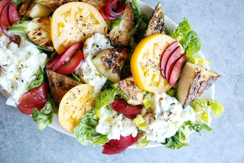heirloom tomato, zucchini and plum salad with burrata