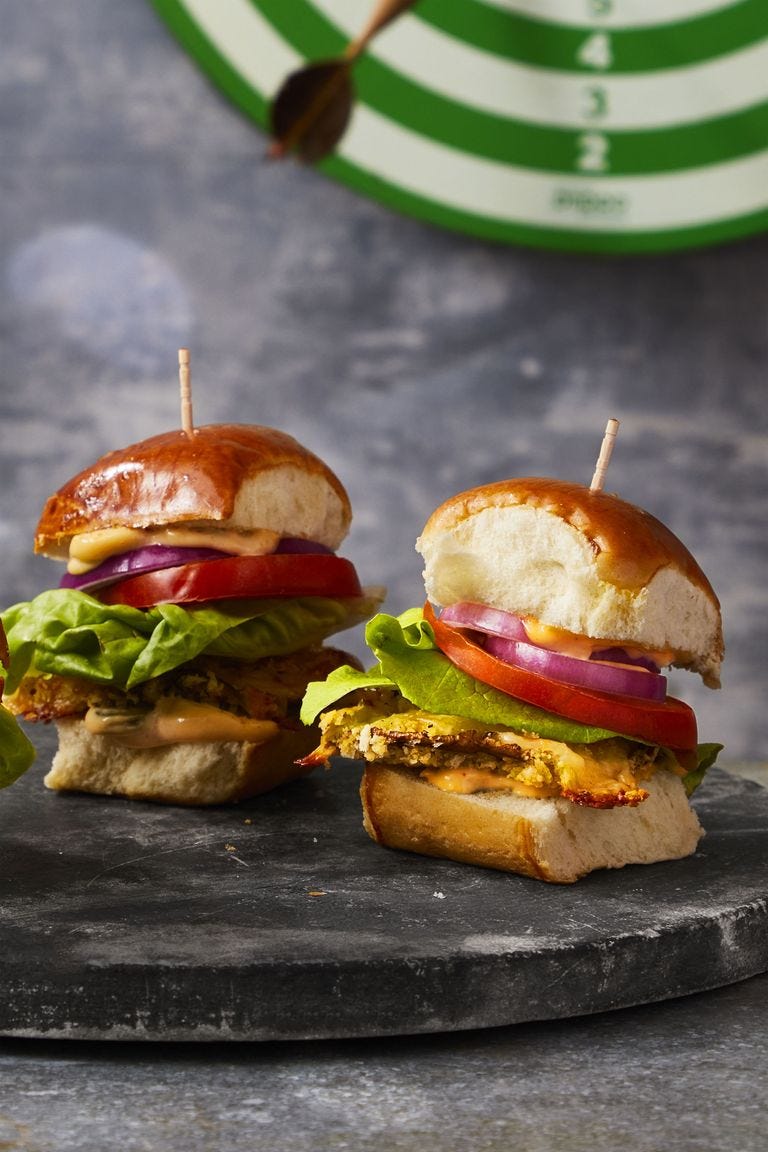 two handheld mushroom burgers