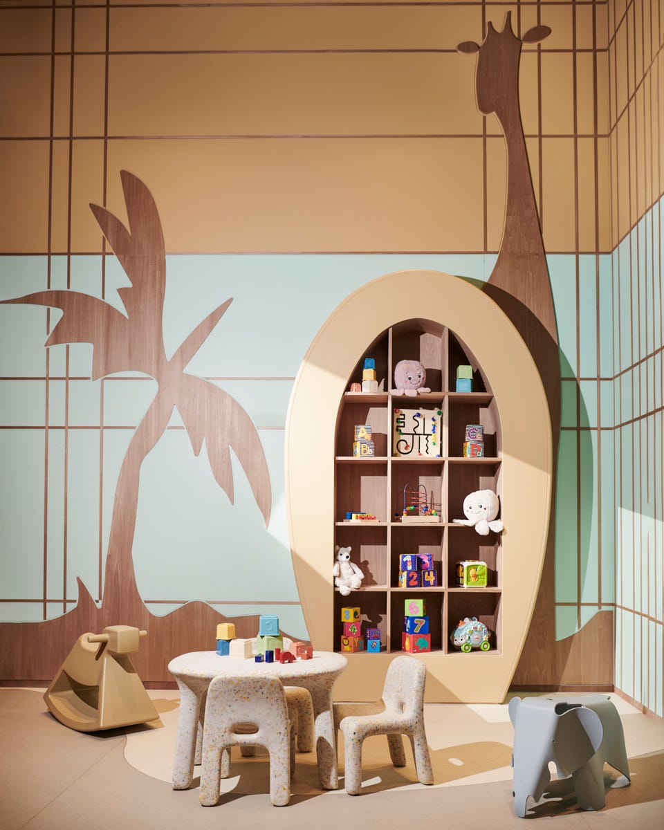 a room with a table and shelves