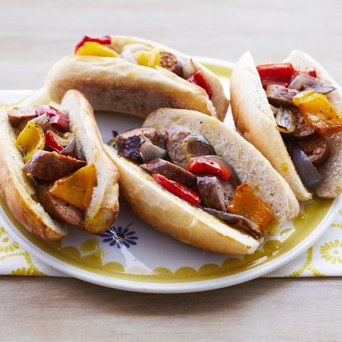sheet pan sausage and pepper hoagies on yellow plate