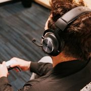 story editor wearing a headset while holding controller