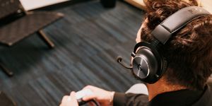 story editor wearing a headset while holding controller