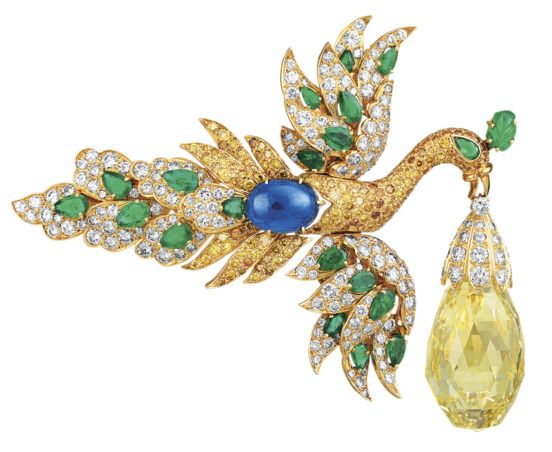 cartier’s yellow pear shaped briolette diamond of more than 95 carats was acquired by van cleef and arpels at the famed 1971 auction and a year later set in this phoenix brooch in yellow gold with yellow and white diamonds emeralds and a sapphire