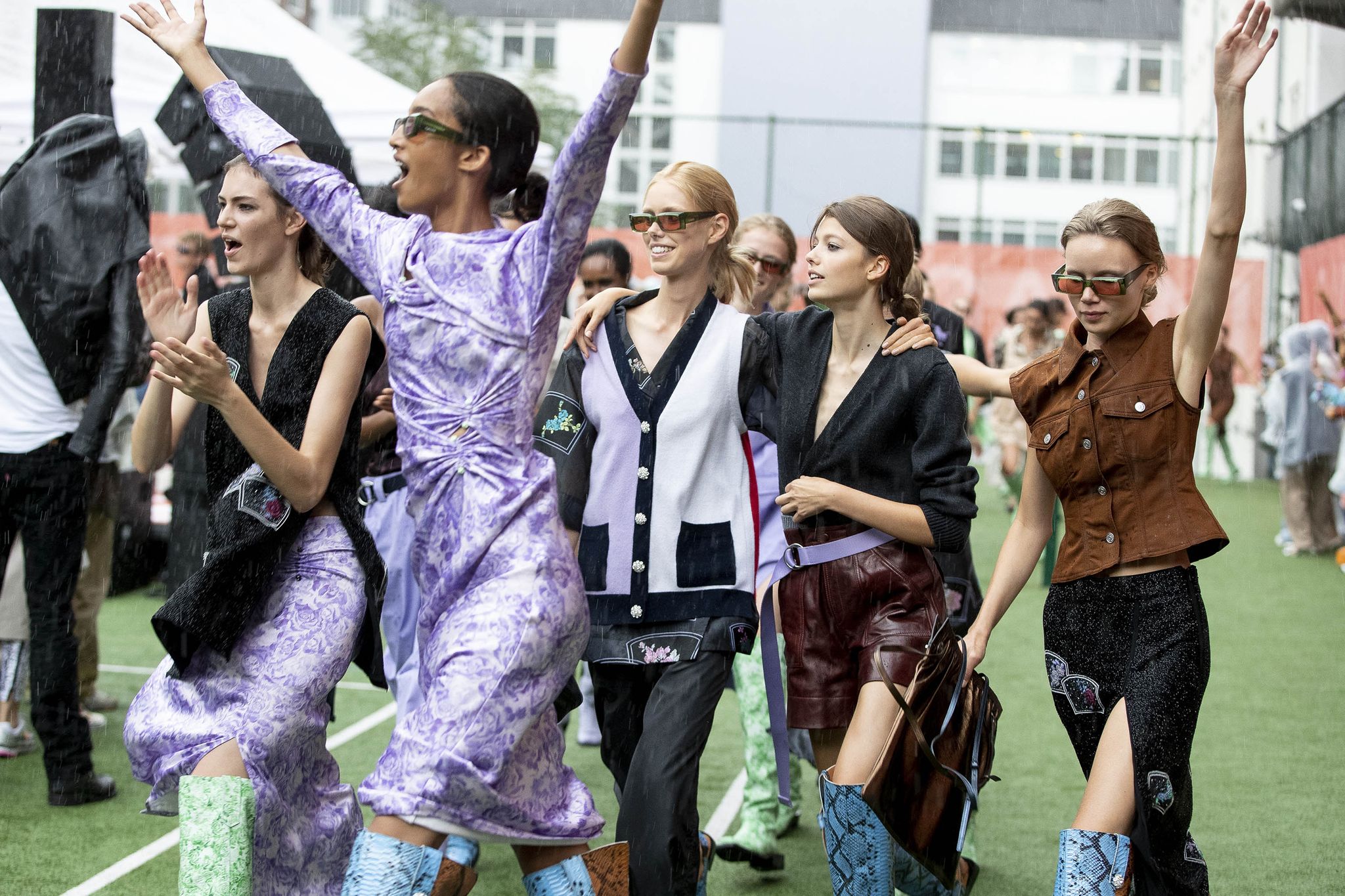 copenhagen, denmark   august 08 happy models walking and dancing in the rain at the final walk during  the ganni show during the copenhagen fashion week springsummer 2020 on august 08, 2019 in copenhagen, denmark photo by yuliya christensengetty images
