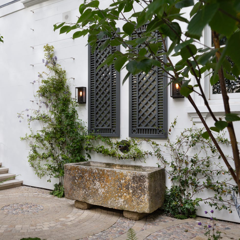 Antique stone trough in Ribbon Wheel Garden by Butter Wakefield