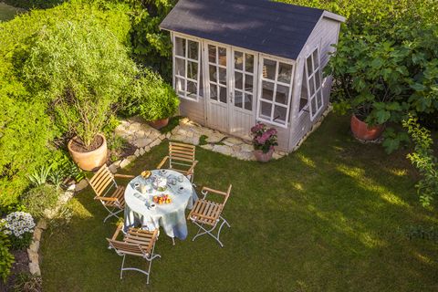 garden shed and laid table in garden
