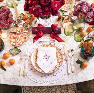 a holiday table full of color and flowers
