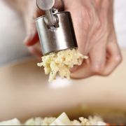 Garlic crushed using a garlic press. Making Lasagna Bolognese Series.