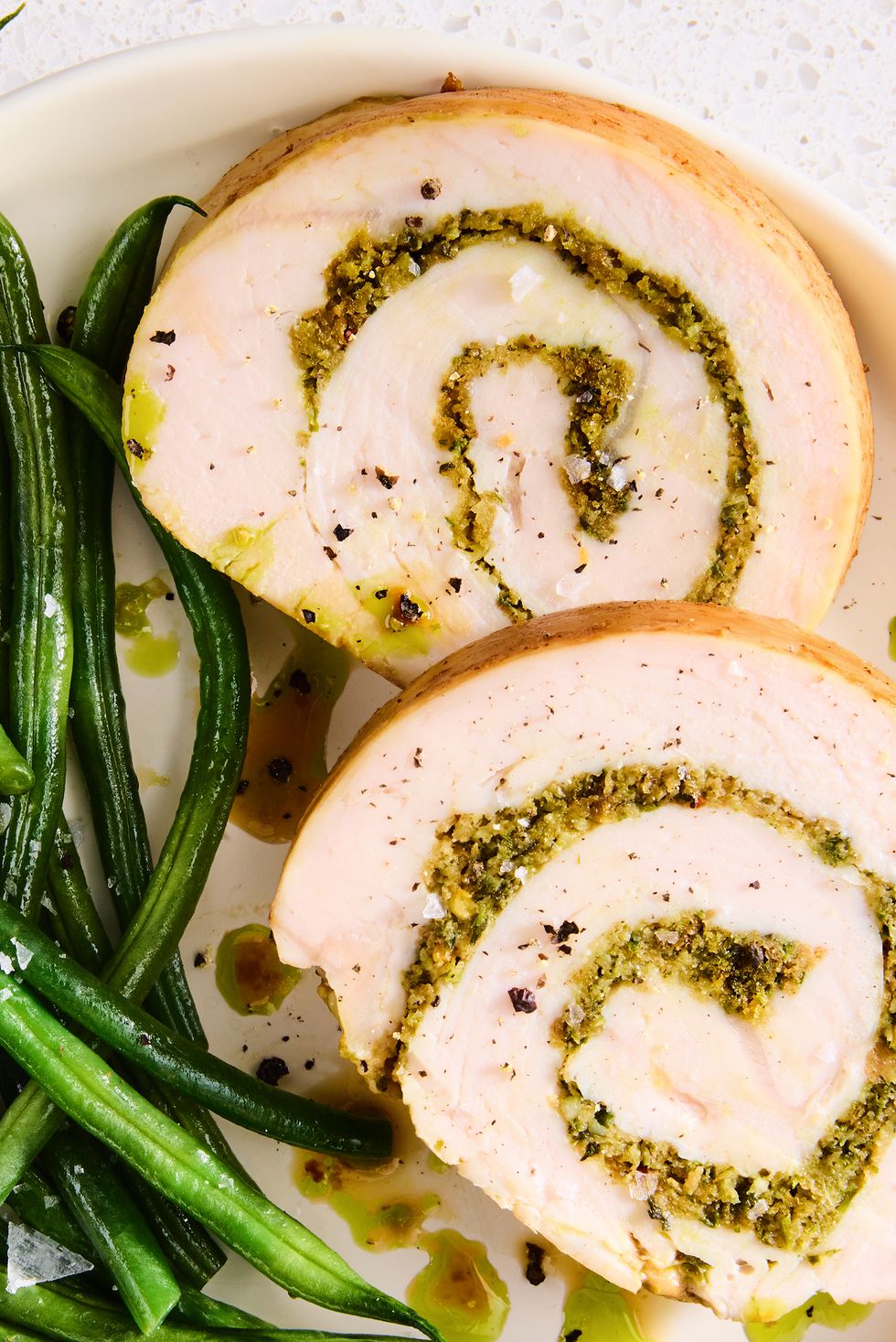 swirls of garlic and herb inside sliced turkey
