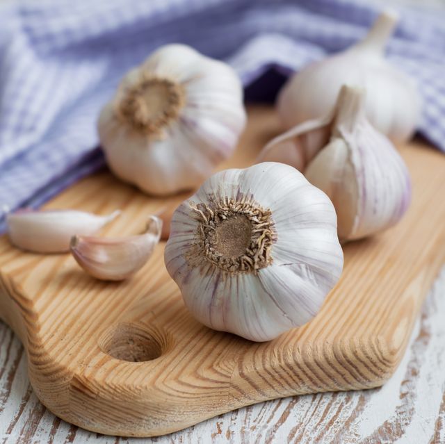 garlic on a old white wooden background