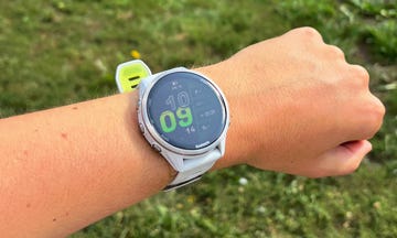 smartwatch displaying time and fitness metrics on a wrist