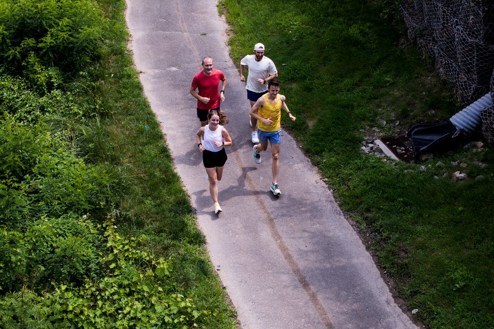 group of runners on paved trail