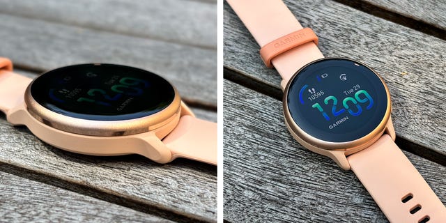 close up of a pink smartwatch with a bright colourful display screen