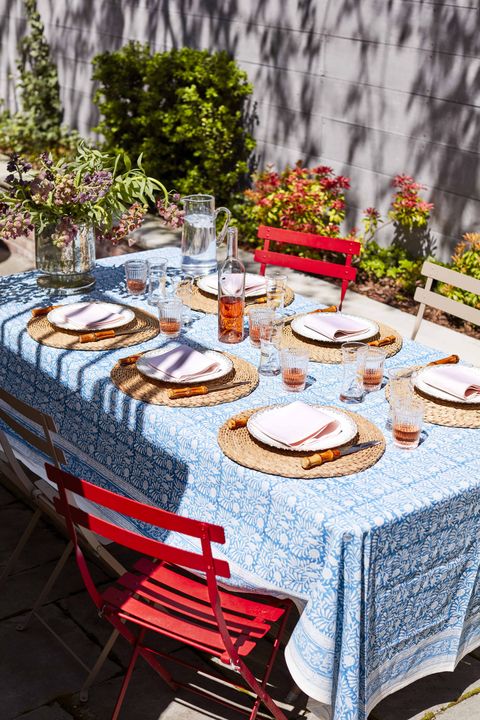 Tablecloth, Table, Textile, Furniture, Dishware, Linens, Serveware, Outdoor table, Petal, Outdoor furniture, 